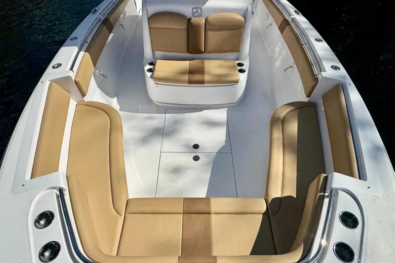 Slide: The Image of 2013 Belzona 32 CC boat interior with tan seating and white deck. - 17