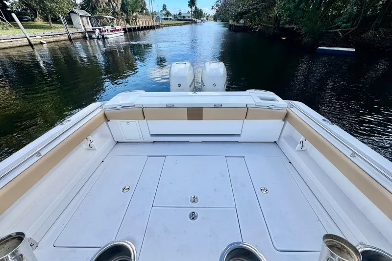 Slide: The Image of 2013 Belzona 32 CC boat deck overlooking a serene waterway. - 29
