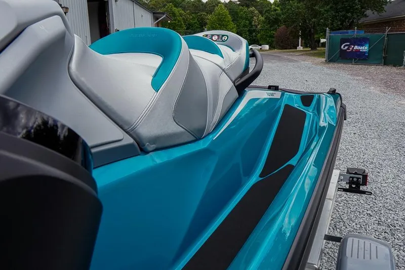 Slide: The Image of 2026 Sea-Doo GTX Limited 325 in vibrant blue, parked on gravel driveway. - 12