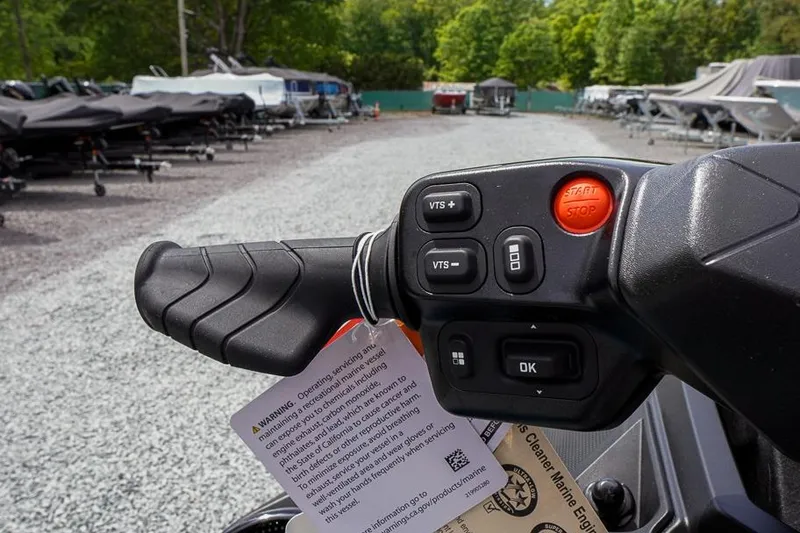Slide: The Image of 2026 Sea-Doo GTX Limited 325 handlebar controls with start/stop button and warning tag. - 16