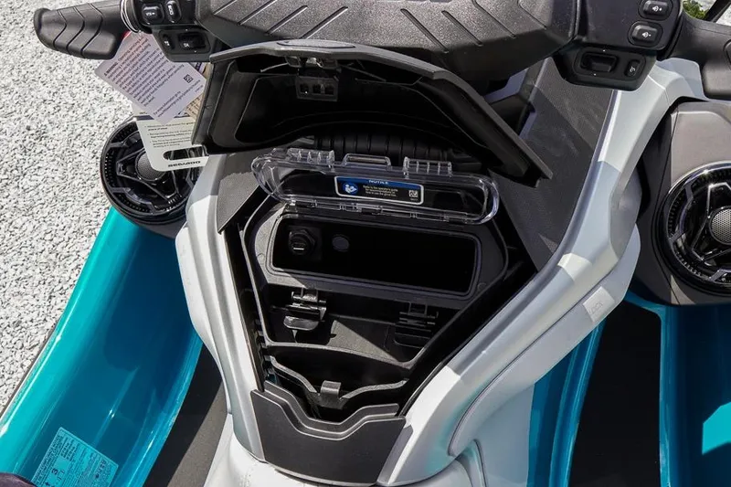 Slide: The Image of 2026 Sea-Doo GTX Limited 325 dashboard with open storage compartment. - 17