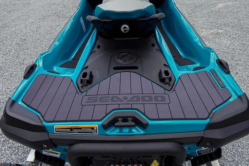 Slide: The Image of 2026 Sea-Doo GTX Limited 325, teal color, rear view on gravel surface. - 4