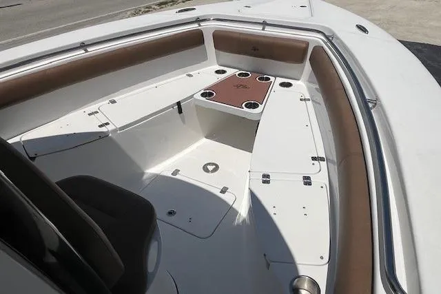 Slide: The Image of 2019 Sea Pro 259 Center Console boat interior with seating and storage compartments. - 3