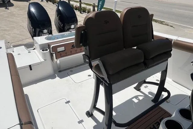 Slide: The Image of 2019 Sea Pro 259 Center Console boat interior with dual seats and twin engines. - 5