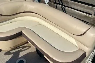 Slide: The Image of 2016 Sun Tracker Party Barge 22 XP3 with beige seating on deck. - 10