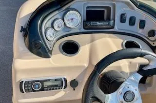 Slide: The Image of 2016 Sun Tracker Party Barge 22 XP3 dashboard with steering wheel and gauges. - 14