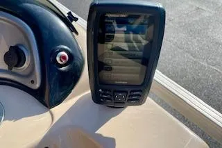 Slide: The Image of 2016 Sun Tracker Party Barge 22 XP3 dashboard with a mounted fish finder. - 15
