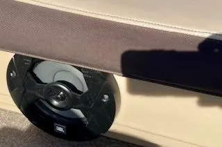 Slide: The Image of 2016 Sun Tracker Party Barge 22 XP3 speaker detail with brown upholstery. - 16