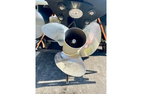 Slide: The Image of 2016 Sun Tracker Party Barge 22 XP3 propeller, close-up view on pavement. - 21