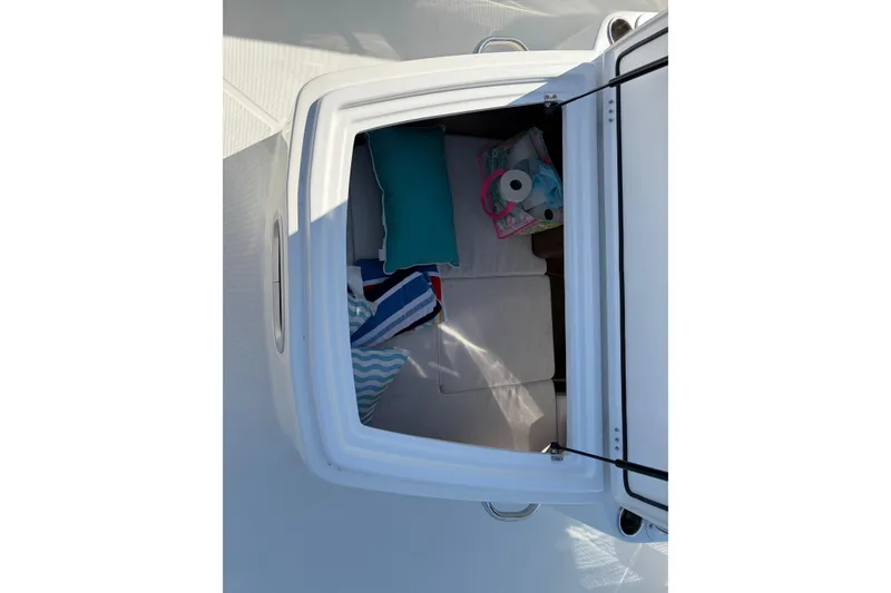 Slide: The Image of Interior cabin view of 2024 Jeanneau Leader 9.0 CC with cushions and storage. - 13