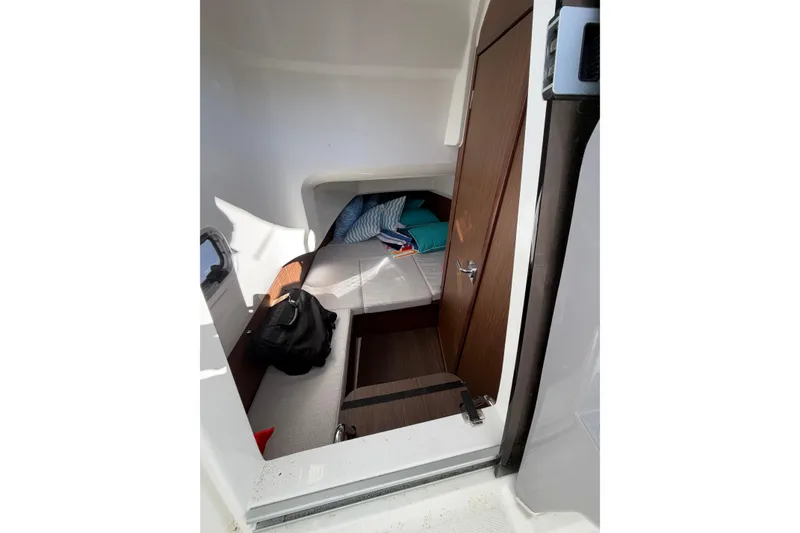 Slide: The Image of Interior cabin of 2024 Jeanneau Leader 9.0 CC with cozy bedding and storage. - 15
