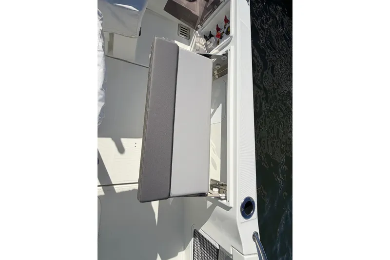 Slide: The Image of 2024 Jeanneau Leader 9.0 CC boat seat detail with water view. - 19