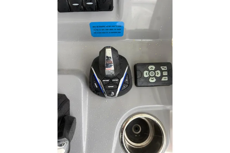 Slide: The Image of Control panel of 2024 Jeanneau Leader 9.0 CC boat with joystick and buttons. - 6