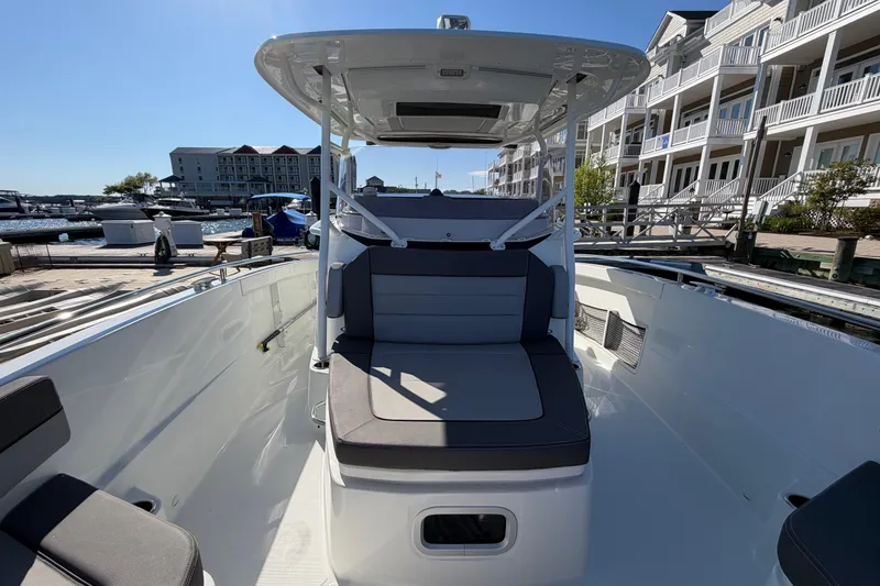 Slide: The Image of 2024 Jeanneau Leader 9.0 CC boat docked at a marina, showcasing sleek seating and modern design. - 8