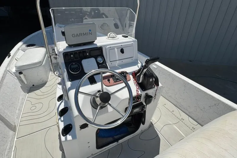 Slide: The Image of 2005 Kenner 21 VX boat console with Garmin GPS and steering wheel. - 6