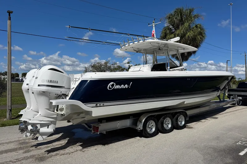 Slide: The Image of 2012 Intrepid 400 Center Console boat with Yamaha engines on a trailer. - 11