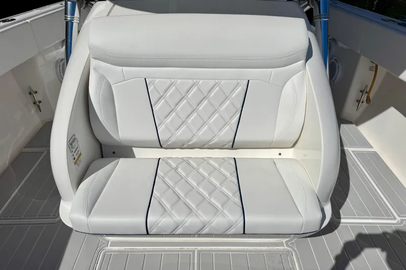 Slide: The Image of White cushioned seating on 2012 Intrepid 400 Center Console boat, featuring diamond stitching. - 20