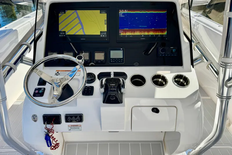 Slide: The Image of 2012 Intrepid 400 Center Console helm with dual displays and stainless steel steering wheel. - 21