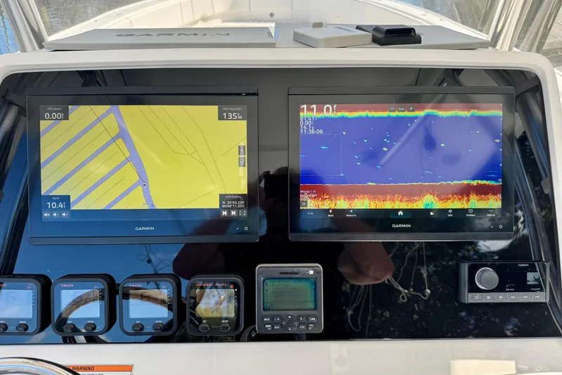 Slide: The Image of Garmin navigation and sonar displays on a 2012 Intrepid 400 Center Console boat. - 23