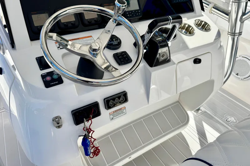 Slide: The Image of Steering console of a 2012 Intrepid 400 Center Console boat. - 24