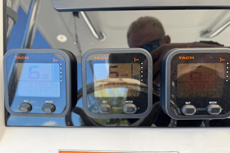 Slide: The Image of Digital tachometers on a 2012 Intrepid 400 Center Console boat dashboard. - 25