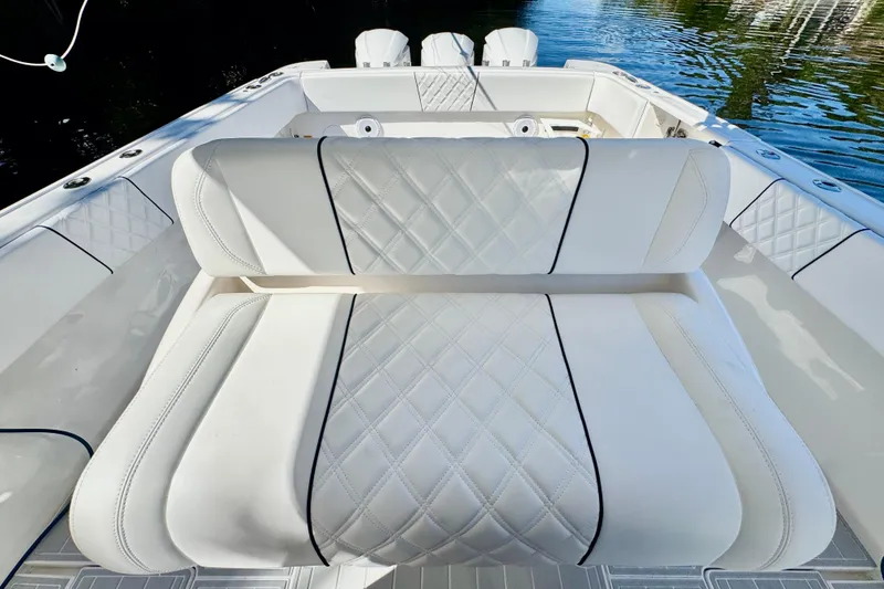 Slide: The Image of Luxurious seating on 2012 Intrepid 400 Center Console boat, featuring diamond-stitched upholstery. - 28