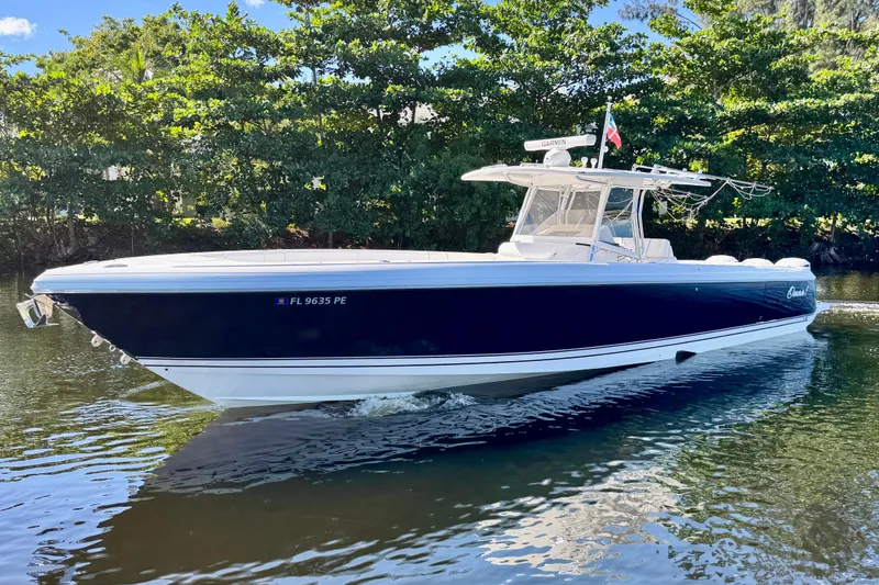 Slide: The Image of 2012 Intrepid 400 Center Console boat cruising on a calm river. - 3