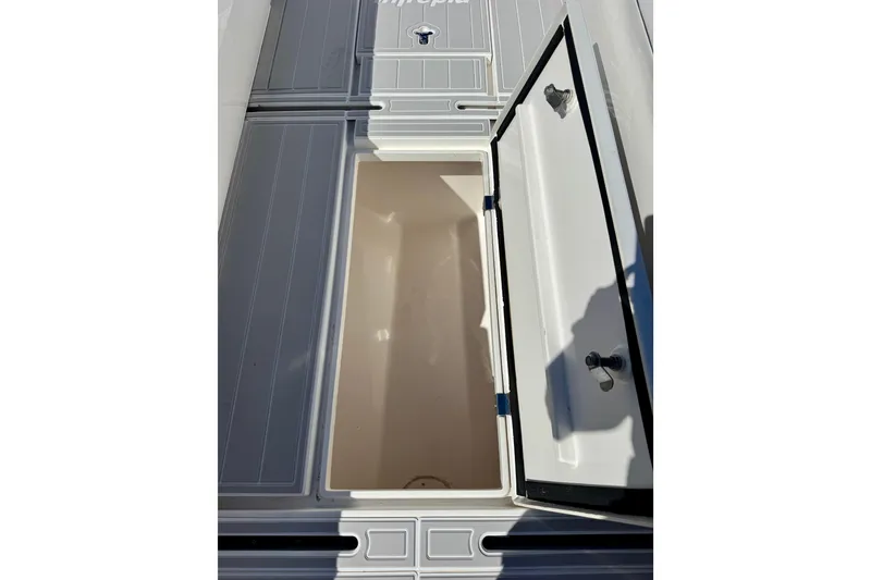 Slide: The Image of Open storage compartment on a 2012 Intrepid 400 Center Console boat. - 34