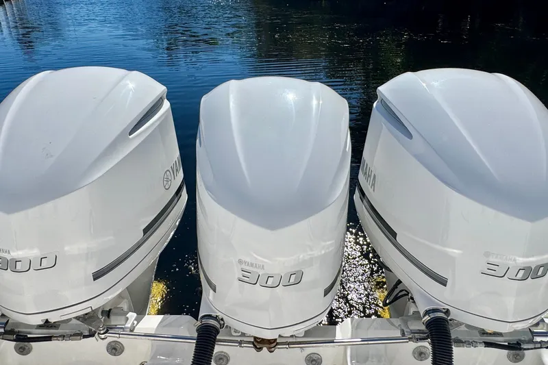 Slide: The Image of Triple Yamaha 300 outboard engines on a 2012 Intrepid 400 Center Console boat. - 37