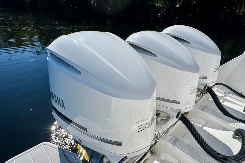 Slide: The Image of Triple Yamaha outboard engines on a 2012 Intrepid 400 Center Console boat. - 38