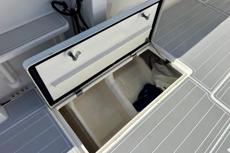 Slide: The Image of Open storage compartment on 2012 Intrepid 400 Center Console boat deck. - 39