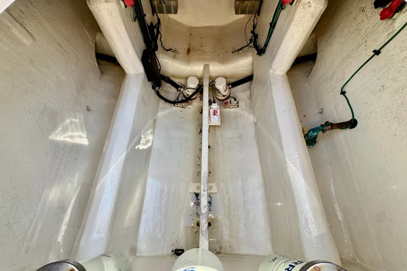 Slide: The Image of Interior view of a 2012 Intrepid 400 Center Console boat's engine compartment. - 40