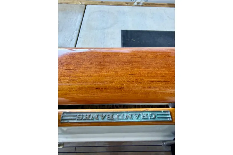 Slide: The Image of Polished wooden rail on 1991 Grand Banks 36 Europa yacht, showcasing craftsmanship. - 10