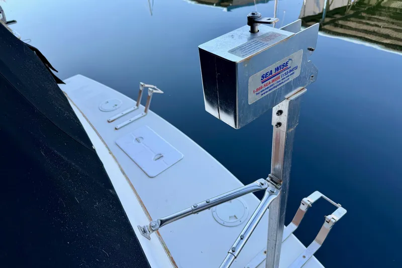 Slide: The Image of Grand Banks 36 Europa 1991 boat with Sea Wise davit system by calm water. - 12
