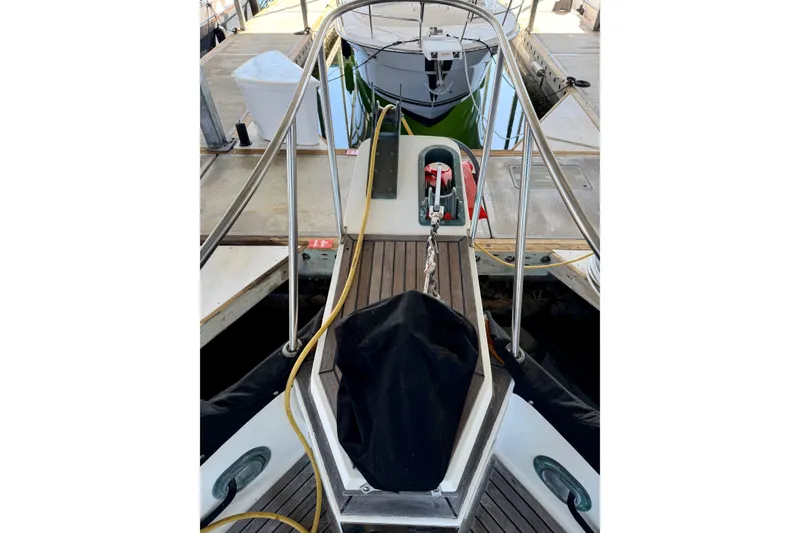 Slide: The Image of Bow view of 1991 Grand Banks 36 Europa yacht docked at marina. - 15
