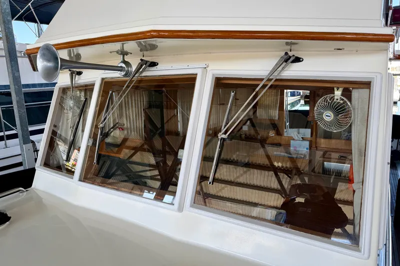Slide: The Image of 1991 Grand Banks 36 Europa yacht with windshield wipers and fan, showcasing classic design. - 17