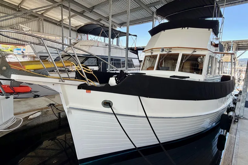 Slide: The Image of 1991 Grand Banks 36 Europa yacht docked in a covered marina. - 2