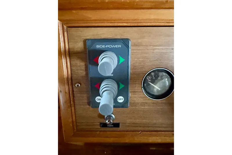 Slide: The Image of Control panel of 1991 Grand Banks 36 Europa boat with Side-Power thruster controls. - 27