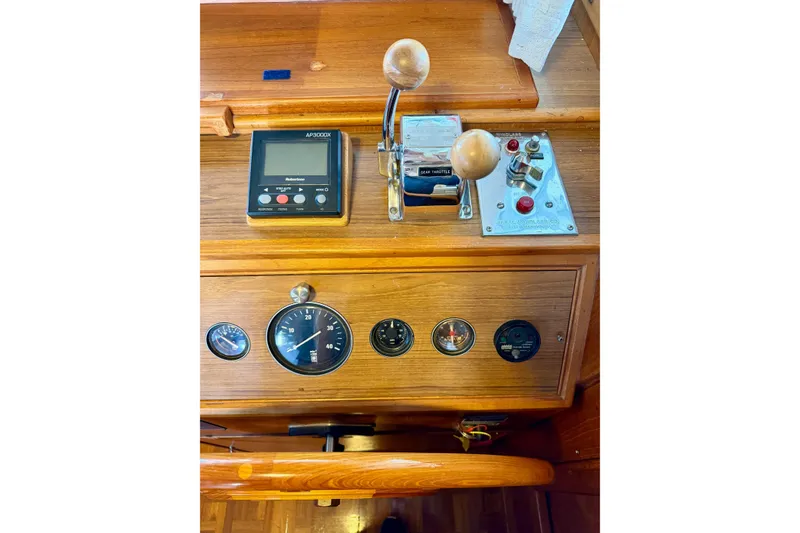 Slide: The Image of 1991 Grand Banks 36 Europa helm with gauges, controls, and AP3000X autopilot. - 28