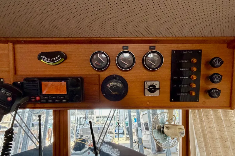 Slide: The Image of Control panel of a 1991 Grand Banks 36 Europa boat with gauges and switches. - 29