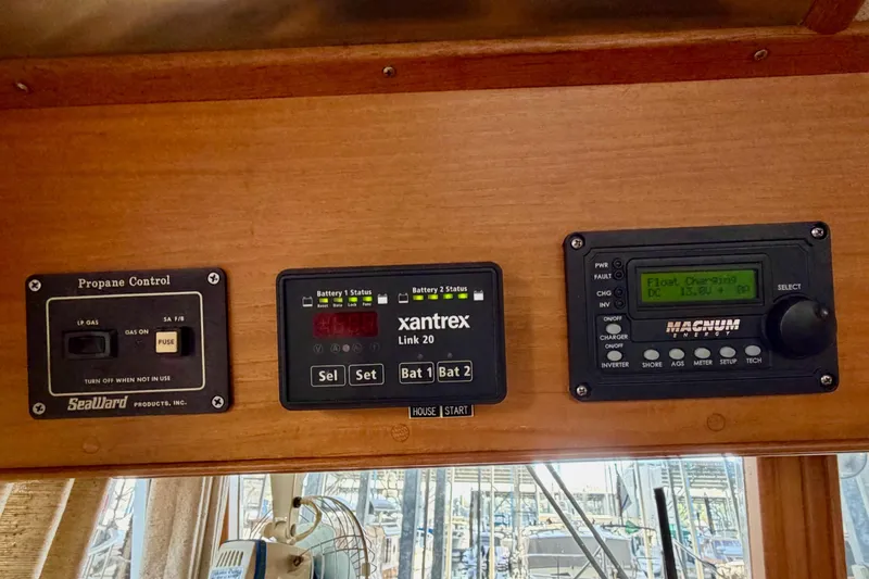 Slide: The Image of Control panel on 1991 Grand Banks 36 Europa boat with propane and battery monitors. - 30