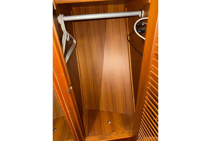 Slide: The Image of Wooden closet interior on 1991 Grand Banks 36 Europa boat. - 37