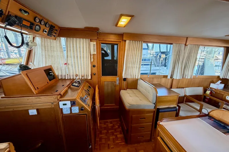 Slide: The Image of Interior of a 1991 Grand Banks 36 Europa yacht with wooden furnishings and navigation equipment. - 39