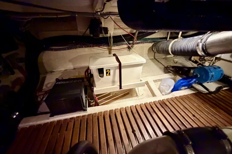 Slide: The Image of Engine room of 1991 Grand Banks 36 Europa with equipment and wooden flooring. - 43