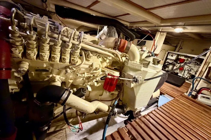 Slide: The Image of Engine room of a 1991 Grand Banks 36 Europa, showcasing detailed mechanical components. - 44