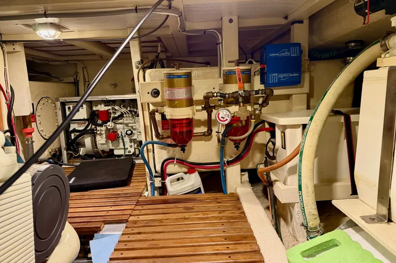 Slide: The Image of Engine room of a 1991 Grand Banks 36 Europa, showcasing mechanical components and systems. - 45