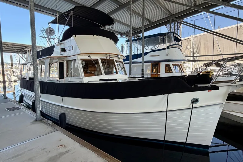 Slide: The Image of 1991 Grand Banks 36 Europa yacht docked in a covered marina. - 5