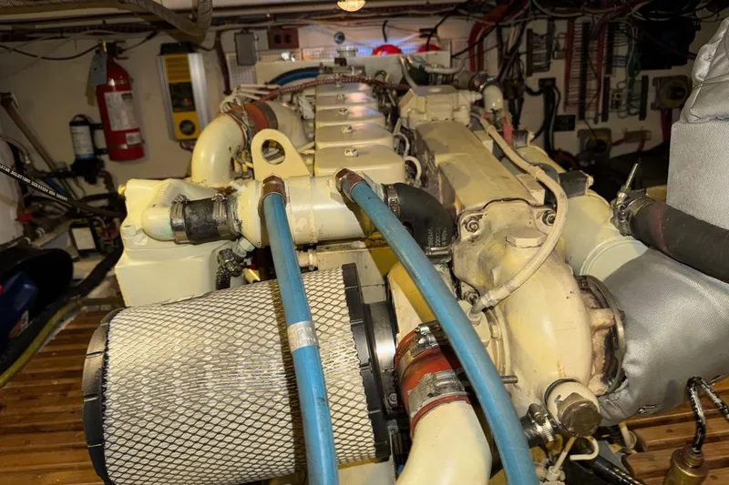 Slide: The Image of Engine room of a 1991 Grand Banks 36 Europa, showcasing detailed mechanical components. - 51
