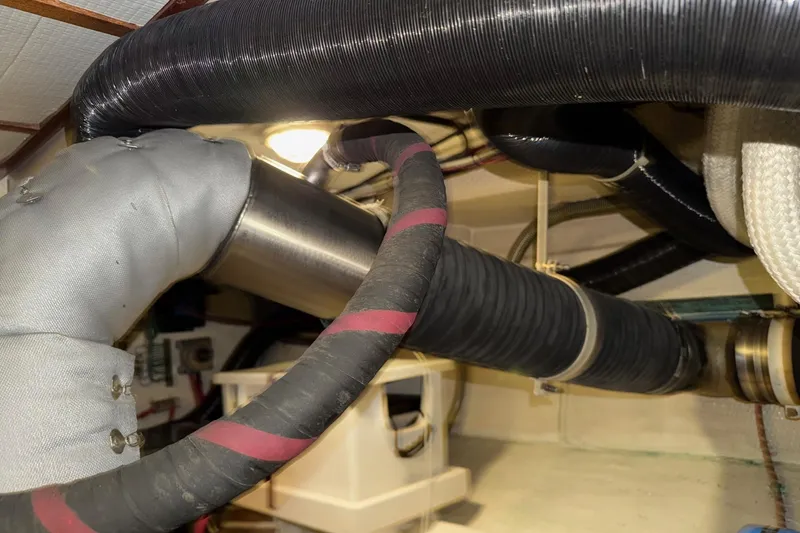 Slide: The Image of Engine room of 1991 Grand Banks 36 Europa with insulated pipes and ventilation system. - 52