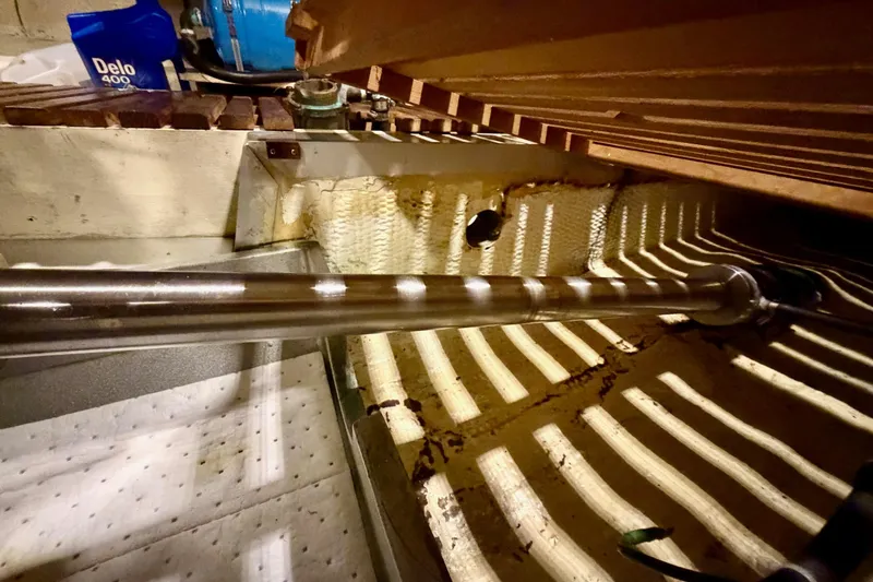 Slide: The Image of Engine room of 1991 Grand Banks 36 Europa with visible shaft and Delo 400 oil container. - 53
